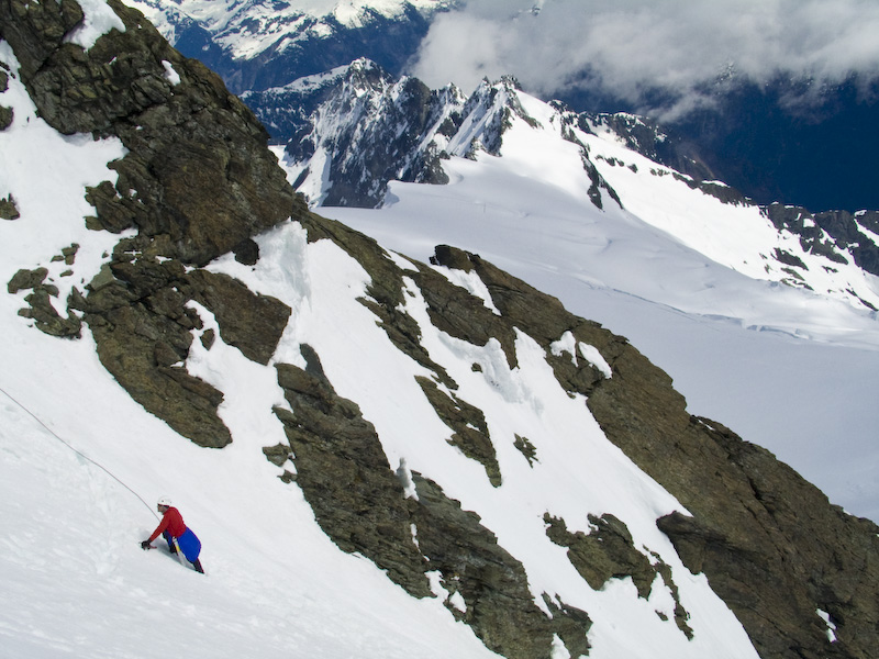 Climber Ascending The Summit Pyramid Of Mount Shuksan